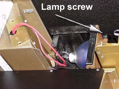 6. Loosen the lamp screw to the right rear of the lamp. 3. Loosen the lamp screw. 4. Pull the lamp toward you and to the right. 5. Disconnect the lamp cable. Replacing the lamp 1.