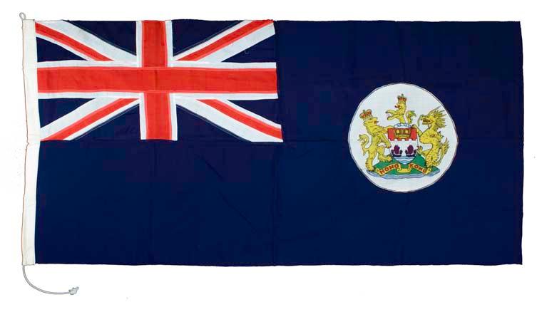 [Hong Kong Flag Pre 1997] British Hong Kong Flag Large pre-1997 British Hong Kong stitched cloth flag featuring the Union Jack and Ensign. Cord tie. Flag measures 90 x 183cm.