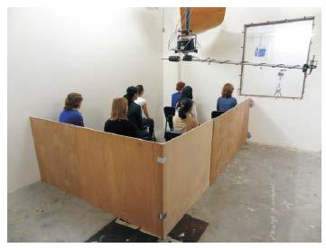 Figure 4.3. Sound absorption measurement setup in the reverberation room: (a) 1.0 m 2 per chair with 8 chairs; (b) 2.0 m 2 per chair with 4 chairs. Figure 4.4. Sound absorption measurement setup in the reverberation room with 1 m 2 per chair occupied by 8 women.