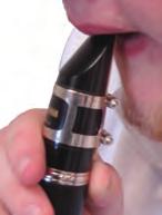 ) Clarinet Day 1 T: Next, place ½ inch of the mouthpiece into the mouth and make contact with the upper teeth as in the picture to the right.