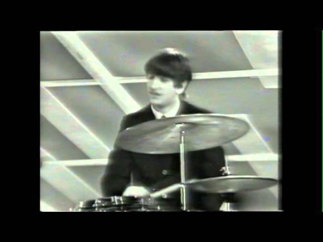 Beatlemania In 1963, The Beatles make their debut beginning what will become Beatlemania. They hit the top of the charts with She Loves You in 1963.