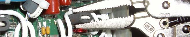 the wire loop (see Figure 3). It is advisable to slightly tilt the module to the side to ensure the ferrite falls away from the module.