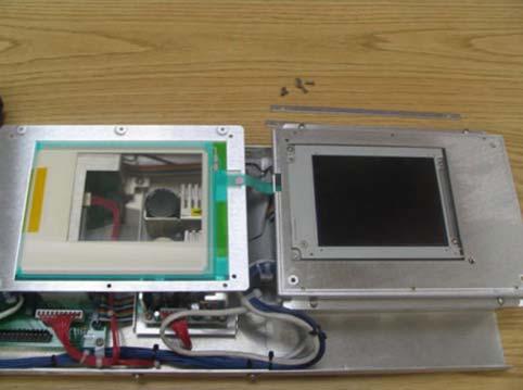 Remove the six screws, top and bottom, and flip the touch sensor frame to the