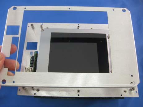 Remove the (4) Screws securing the LCD to the panel and the