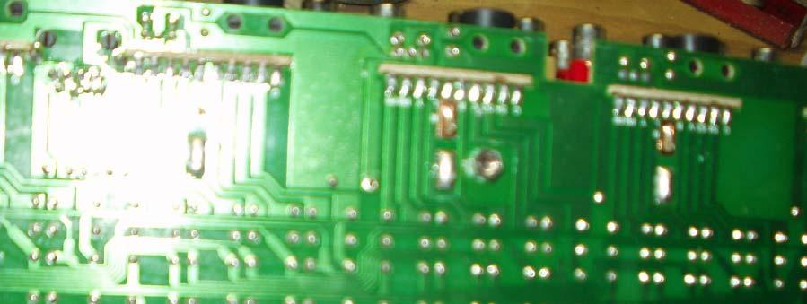 Lines show back side of board, CMOS pins, installed CMOS is on left, (Blue arrow), placeholder for #2 is on right (Red).