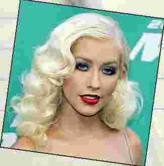 Non-Humorous Before: Christina Aguilera has long eyelashes.