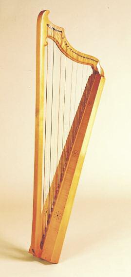 Left: a Northern European single-row harp (ca. 1650-1700), alias the Boston Harp. Below: Bill Campbell plays a replica of an ancient Egyptian harp.