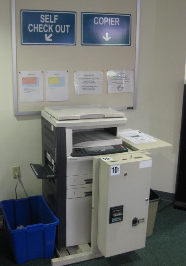 This is a photocopier. This is a machine that can photocopy pages. Machines are located by the Circulation Desk, in the Periodicals area, and in Adult Reference.