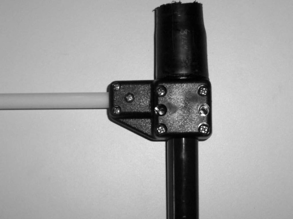 Next insert the #4 screws and Nylok nuts used to properly secure the 3/8 white fiberglass rod that stiffens the return loop assembly.