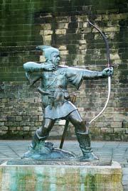 4 Robin Hood statue in Nottingham, Enngland (left). Illustration of the Sheriff of Nottingham by Louis John Rhead, 1912.