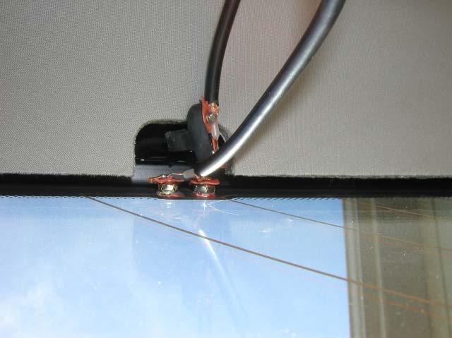 2. Attach the converter cables that you made (See Figure 10). Feed the cables over the headliner. Figure 12 Route the cables along the window toward the rear corner.