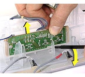 Take Apart User Control Board - 55 2 Use a plastic or nylon flat-blade screwdriver to gently pry up each side of the
