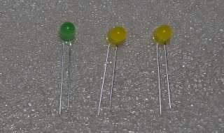 4.12 D7 (5mm Green LED) D6, D8 (5mm Yellow LED) SET, ADJ, ALARM, DST (Push switches) First, bend the leads of the LEDs as shown below, paying attention to the longer (+)