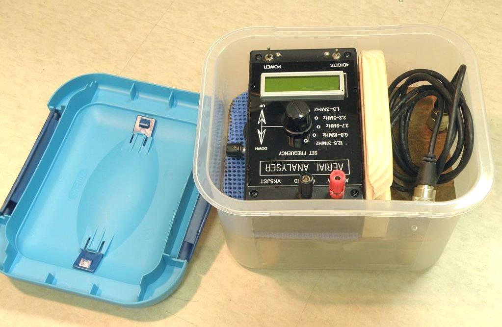To transport my VK5JST Aerial Analyser and carry it into the field I made a case out of a plastic CD box from Wal-Mart. There is a removable shelf with a wood handle.
