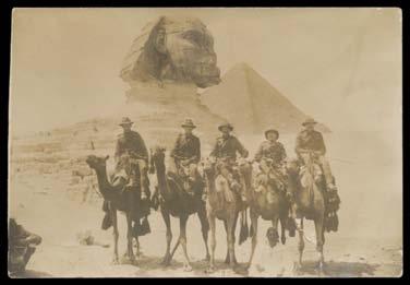 Prestige Philately - Auction No 162 Page: 1 Forces in Egypt Ex Lot 930 930 C/L Real photo PPCs of Kiwis on camels in front of the Sphinx, & boarding a train at Suez; two small aerial photos of the