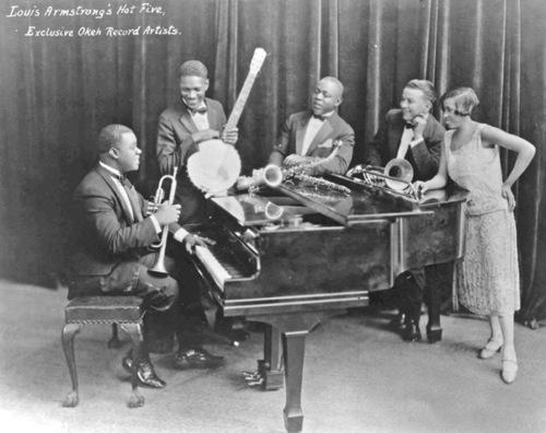 When he was older King Oliver gave him his first real cornet, and even gave him lessons. In 1922 Louis joined Oliver's Creole Jazz Band in Chicago.