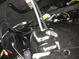 the backside on the glove box right next to where the wires came out using zipties: Next I