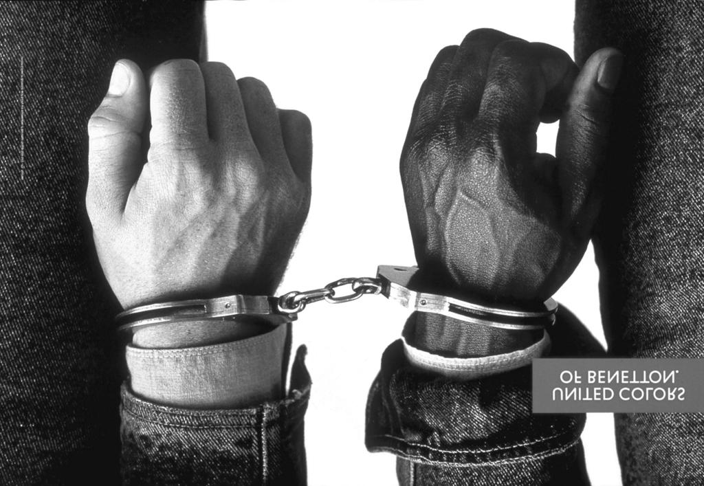 GROUPING, SIMILE AND OXYMORON IN PICTURES 307 FIGURE 4 Handcuffs, an advertisement for Benetton. Copyright 1989 by Oliviero Toscani Studio. Reprinted with permission.