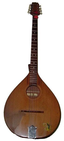 Bouzouki The bouzouki originated in Greece originally with three sets of two strings and a deep round bowl-like back.