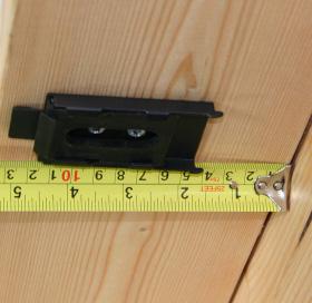 If you are installing a third bracket, install the bracket (ideally on a wood stud) near the center of the shade.