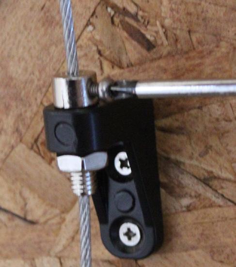 Pull the Cable taut and tighten both the Cable Bolt Nut using a wrench (not included) and Bracket Lock Screw (Fig X). Cut any excess Cable slack underneath the Cable Bracket with wire cutters (Fig Y).
