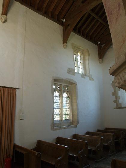 The tracery and cusp work in this Early English window (1150-1250) in the south west wall of the nave, internally above and externally left, is worthy of note for the skill of the medieval stone