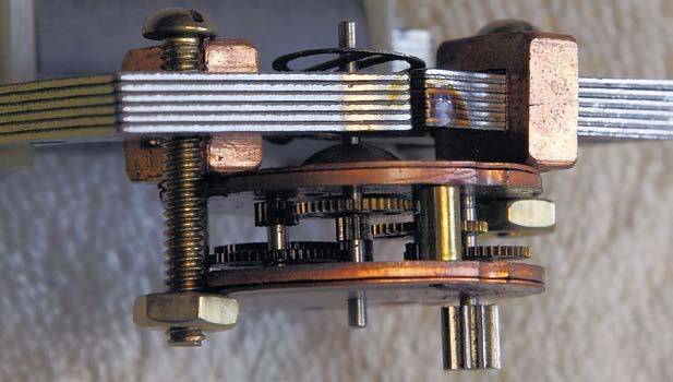 Note two copper bars pressed on the magnets, which induce a slight change to the magnetic field to force the motor to run in one direction. Figure 15. Side view of motor movement in electromagnet.