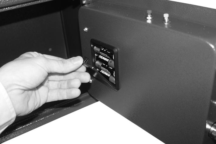 There are holes on the rear and bottom of the safe for securing to a wall or the floor. INSTALLING THE BATTERIES The safe requires 4 x AA (1.5V) batteries. 1. Open the safe.