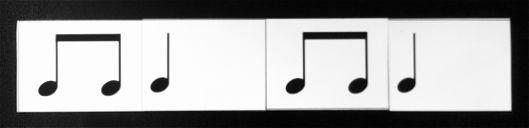 Half note cards (two beats) two inches wide. Two eighth notes together (one beat) are one inch wide, etc.