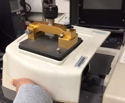 Take it out carefully and lay it on the counter. 2.2 Remove the sample support platform from the FTIR.