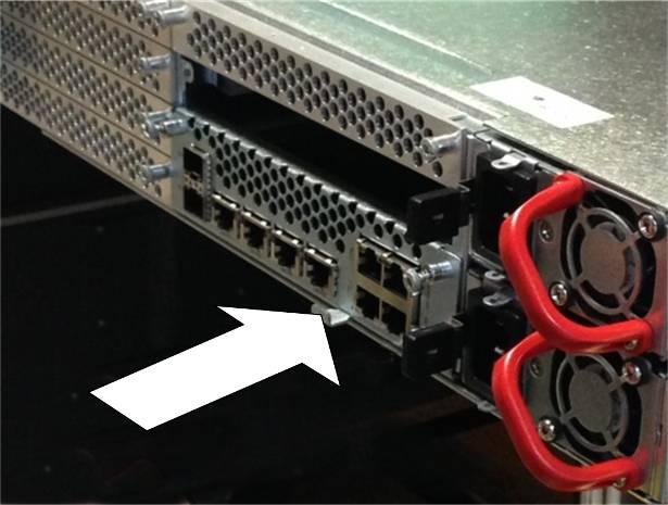 Figure 7.3 Undoing the Host Card Panel Fasteners 2. Using the tab, pull the Host Card rearward to disengage the backplane connector.