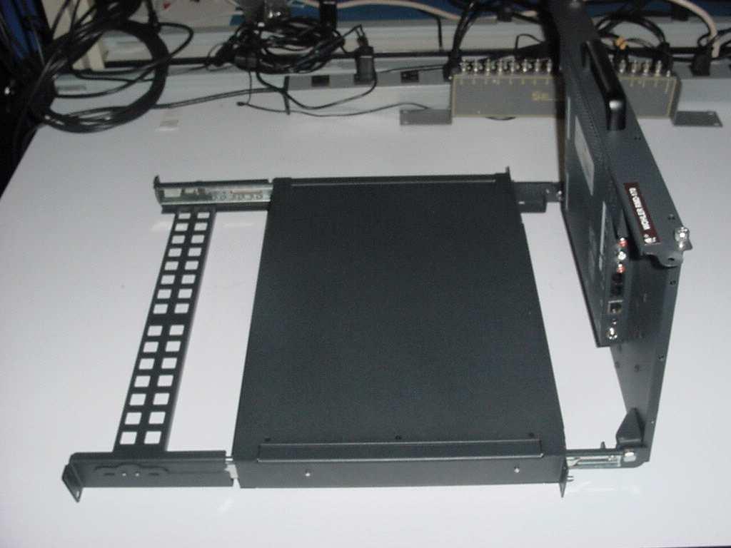 Unpacking and Installation shows the RDM-173-3G tilted up into viewing position, although it is shown outside of the rack enclosure for clarity. You can see the connectors in this figure.