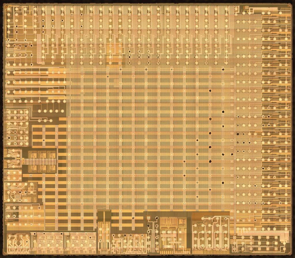Device Identification 3-4 3.2 Die Figure 3.2.1 shows a photograph of the die. The die is 9.02 mm x 7.84 mm as measured from the die seals, or 9.07 mm x 7.89 mm for the whole die.