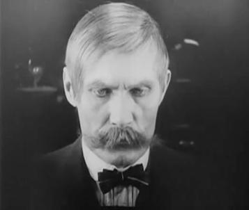 Mabuse also uses his eyes to disorientate von Wenk, who sits confused in a wide shot as darkness begins to fade out both sides of the screen, eventually