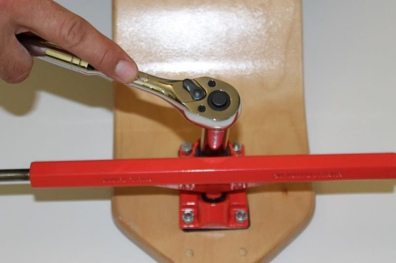 Experienced SlingBoarders may skip this step if they prefer their trucks and steering looser. To tighten the steering use a 14mm deep socket wrench to tighten down the Kingpin bolt.
