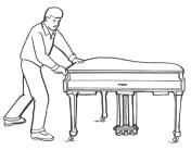 Do not roll the piano on its caster wheels. The legs and pedal assembly may catch on irregular flooring surfaces like door thresholds and soft-to-hard flooring surfaces.