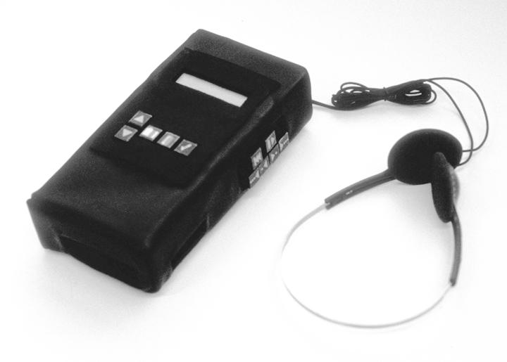 Figure 1: The NewsComm hand-held audio playback device with headphones.