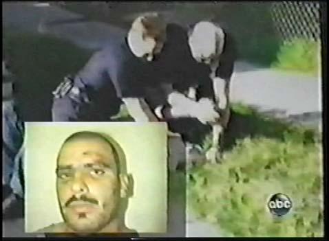 (Frame 26) Frame 26 A still image of the victim is superimposed on top of the footage showing his face after the beating. We see scarring and bruising to his face.