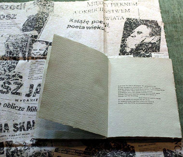 The slipcase incorporates a collage of images of both poets with articles from Polish newspapers in the days following the death