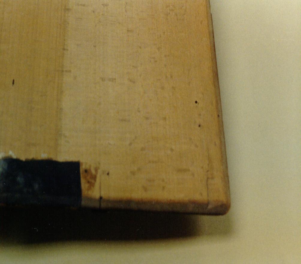 The boards of the book were never covered, but were left bare. (The original straps and brasses are still attached to the boards, with nothing underneath them.