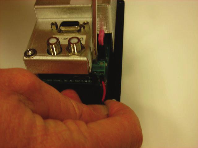 At the antenna control panel, connect the red wire to the + (plus) terminal on