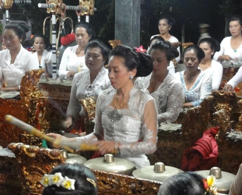 on the kendang, the drummer signaled the group to start, the sounds of the piece carrying throughout the temple where the other villagers, plus Lasmawan s American students, were eating and