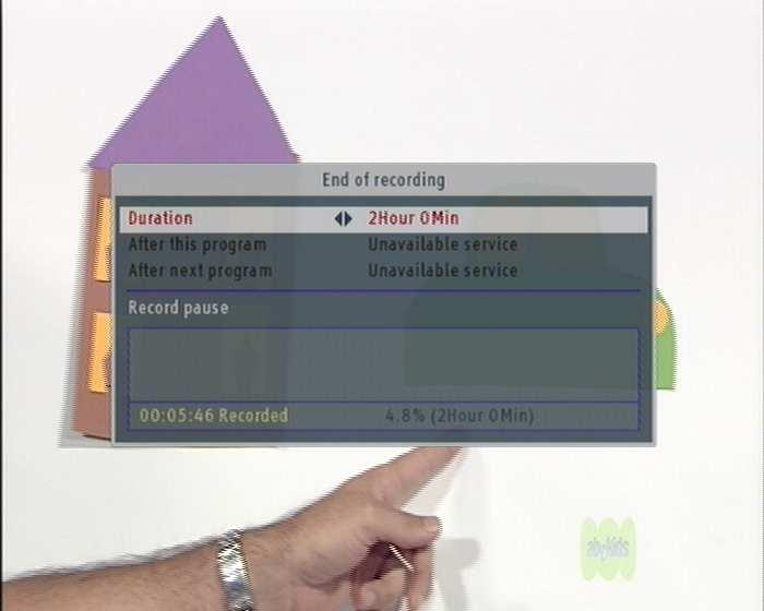 To stop recording, press the button; then a box like the left figure appears, which shows programmes currently being recorded. If you select one, its recording will stop.
