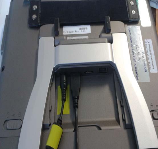 with yellow tape) into the first the printer case and plug the larger connection slot marked PWR end
