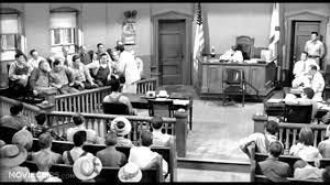 In the middle of To Kill a Mockingbird a courthouse in detail is described to move the plot along (Lee