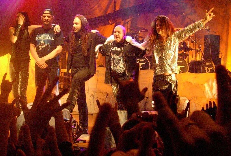 Power metal Swedish power metal band HammerFall after a concert in Milan, Italy, in 2005 During the late 1980s, the power metal scene came together largely in reaction to the harshness of death and
