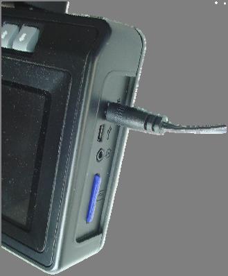 Plug the power supply into an AC outlet and allow the PVM to charge its internal battery.