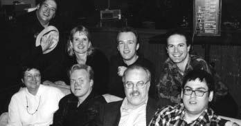 BAT-MEN AND SUPER- WOMEN: (clockwise from bottom left) Composers Walker, Harvey Cohen, Lolita Ritmanis, Michael McCuiston, Kristopher Carter; writer/producers Paul Dini, Alan Burnett and Bruce Timm.