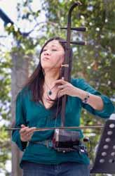 In between gigs she studies fiddle-instruments around the globe with players of all stripes from the erhu, with principal players in China, Taiwan, Canada and the U.S.