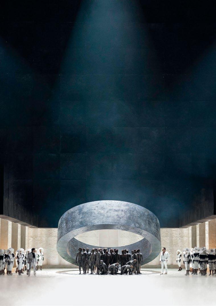 A 000 50025 By placing a giant black ring centre-stage that casts an ominous shadow over the singers and dominates the action, director, set and costume designer Stefano Poda has
